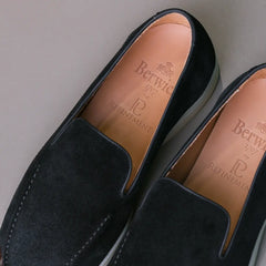 Angled view of the Berwick Flex Walk Apron Stitch Loafers Go Rain Janus Suede Black showcasing toe shape, suede nap, and refined craftsmanship for Clothier & Sons.
