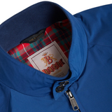 Collar detail of the Baracuta G9 Harrington Jacket Limoges Blue showing the stand collar with double button fastening and ribbed lining for Clothier & Sons.