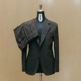 Front view of the Drop6 Wool Suit Charcoal Grey showing the single breasted silhouette, charcoal grey tone, and clean tailored structure for Clothier & Sons.