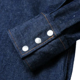 Cuff button detail of the Jelado Vaquero Shirt Indigo showing sleeve placket construction, button hardware, and western-style stitching for Clothier & Sons.