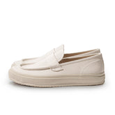 Side profile of the Moonstar Loafy Natural showing the low-cut slip-on silhouette, natural canvas upper, and thick rubber sole for Clothier & Sons.
