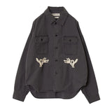 Front view of the Remi Relief Wide Military Shirt Embroidery Tiger Charcoal showing the relaxed silhouette, dual chest pockets, and charcoal base tone.