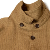 Close-up of raglan sleeve seam and stitching detail on Seuvas C/W Raglan Coverall in khaki.