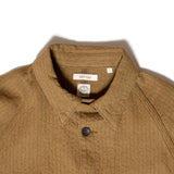 Close-up of structured collar design on Suvas C/W Raglan Coverall in khaki.