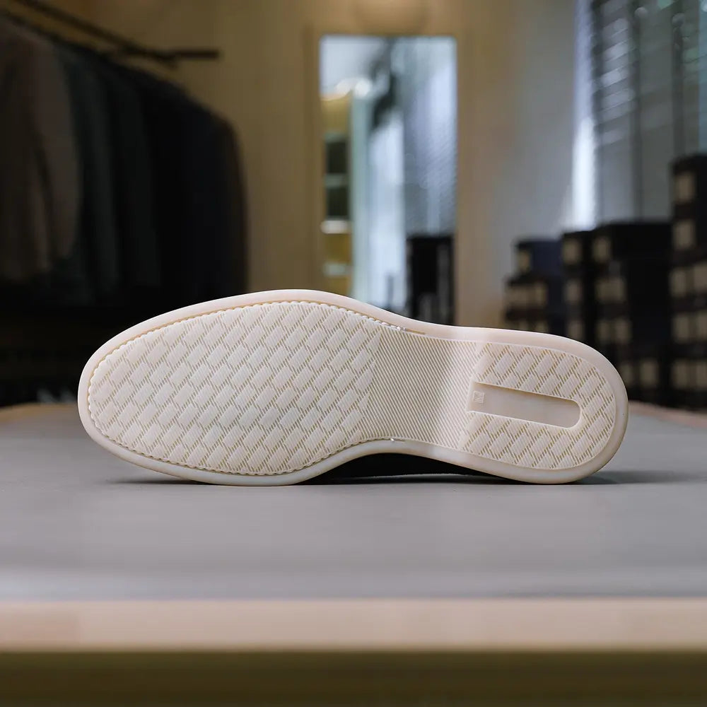 Outsole detail of the Berwick Flex Walk Apron Stitch Loafers Go Rain Janus Suede Black revealing the flexible rubber sole and tread pattern for Clothier & Sons.