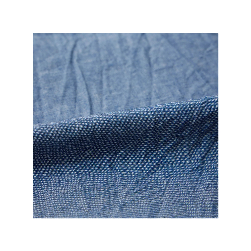 Close-up of indigo chambray fabric texture on Keaton Chase USA pullover shirt