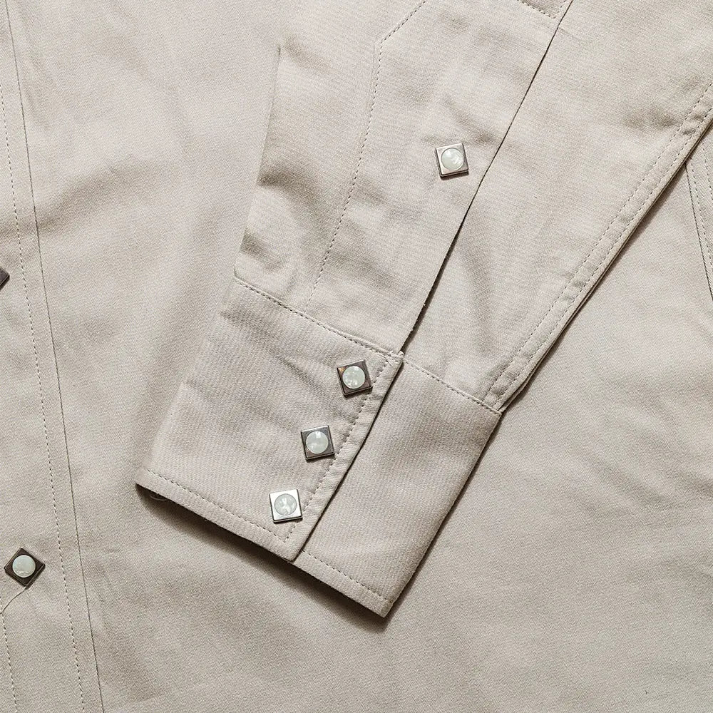 Button detail of the Anatomica Harrison Shirt Sateen Beige highlighting button material, stitching accuracy, and refined everyday detailing for Clothier & Sons.