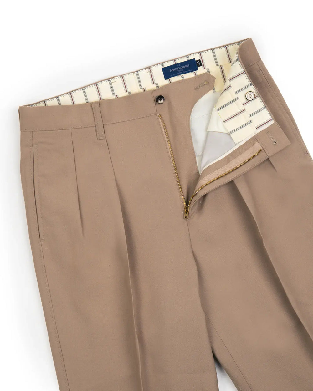 Waist detail of the Barnstormer Double Pleat Chino 1953 Wool Beige showing waistband construction, belt loops, and fastening detail for Clothier & Sons.
