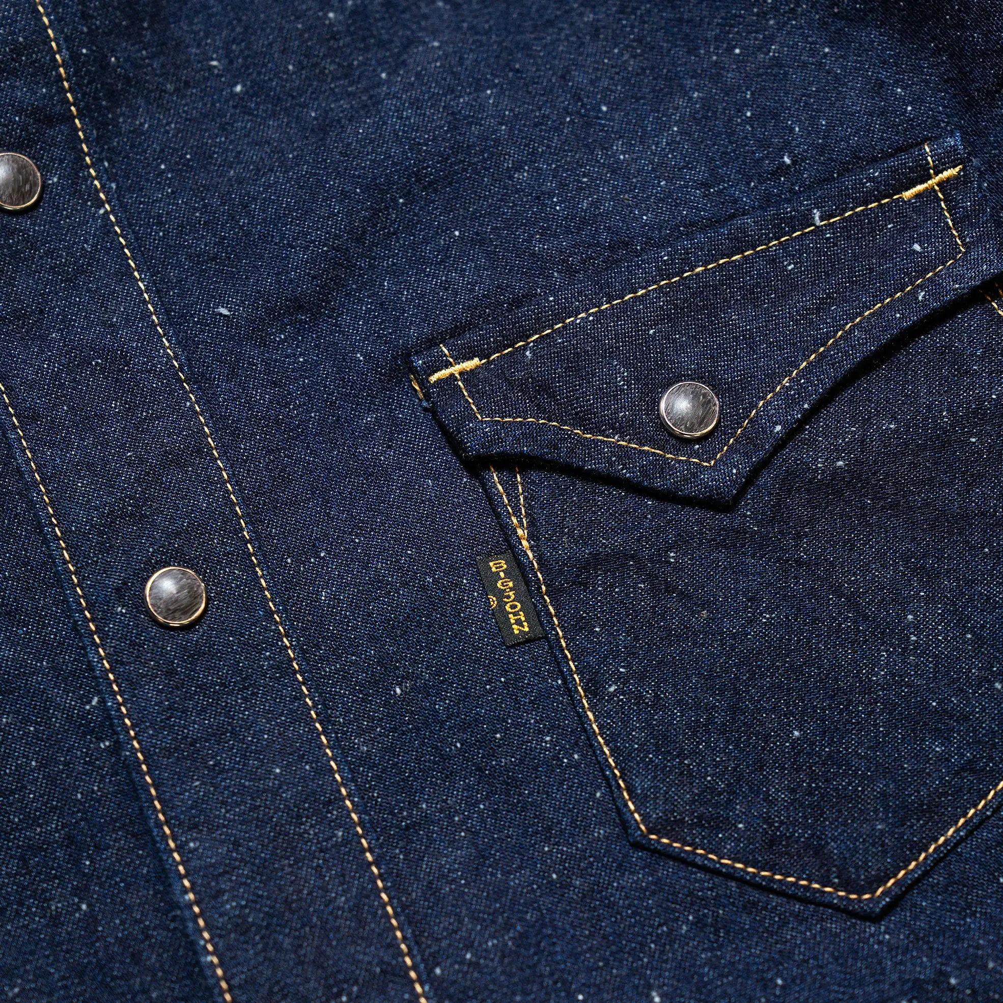 Button detail of the Big John MS004E Shirt Selvedge Denim highlighting button material, stitching precision, and workwear-inspired finishing for Clothier & Sons.