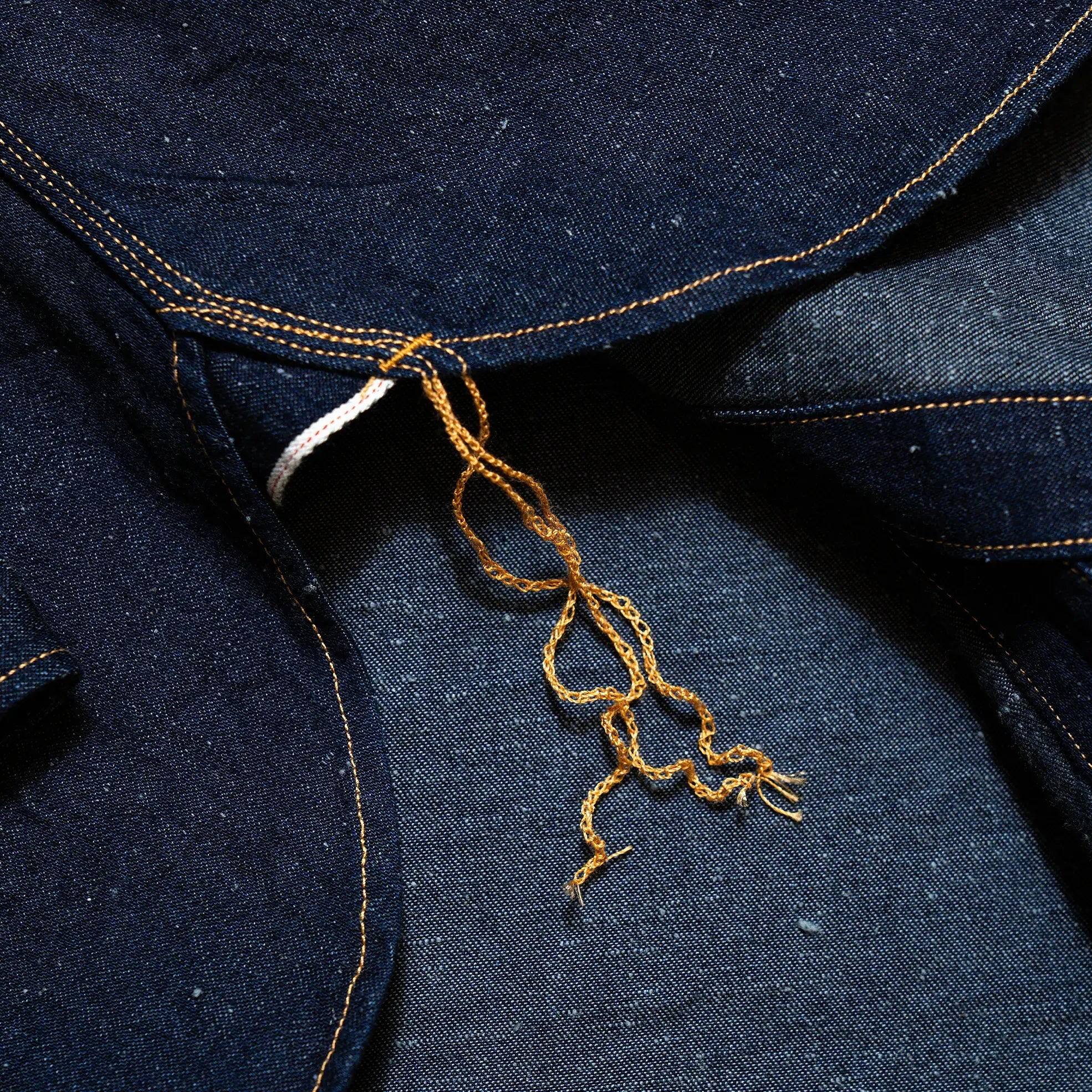 Fabric detail of the Big John MS005E Selvedge Denim revealing the selvedge denim weave, indigo dye depth, and textured surface for Clothier & Sons.