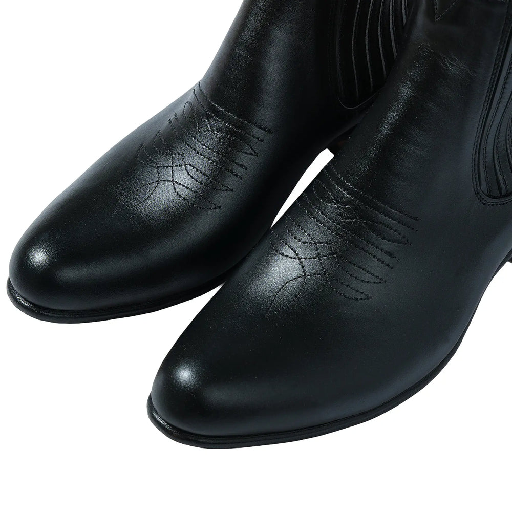 Close-up leather detail of the Chamula Botin Charro Leather Black highlighting natural grain texture and polished finish for Clothier & Sons.