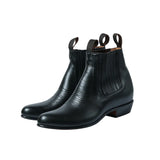 Front three-quarter view of the Chamula Botin Charro Leather Black showing the sleek ankle boot silhouette, smooth black leather upper, and elastic side panels for Clothier & Sons.