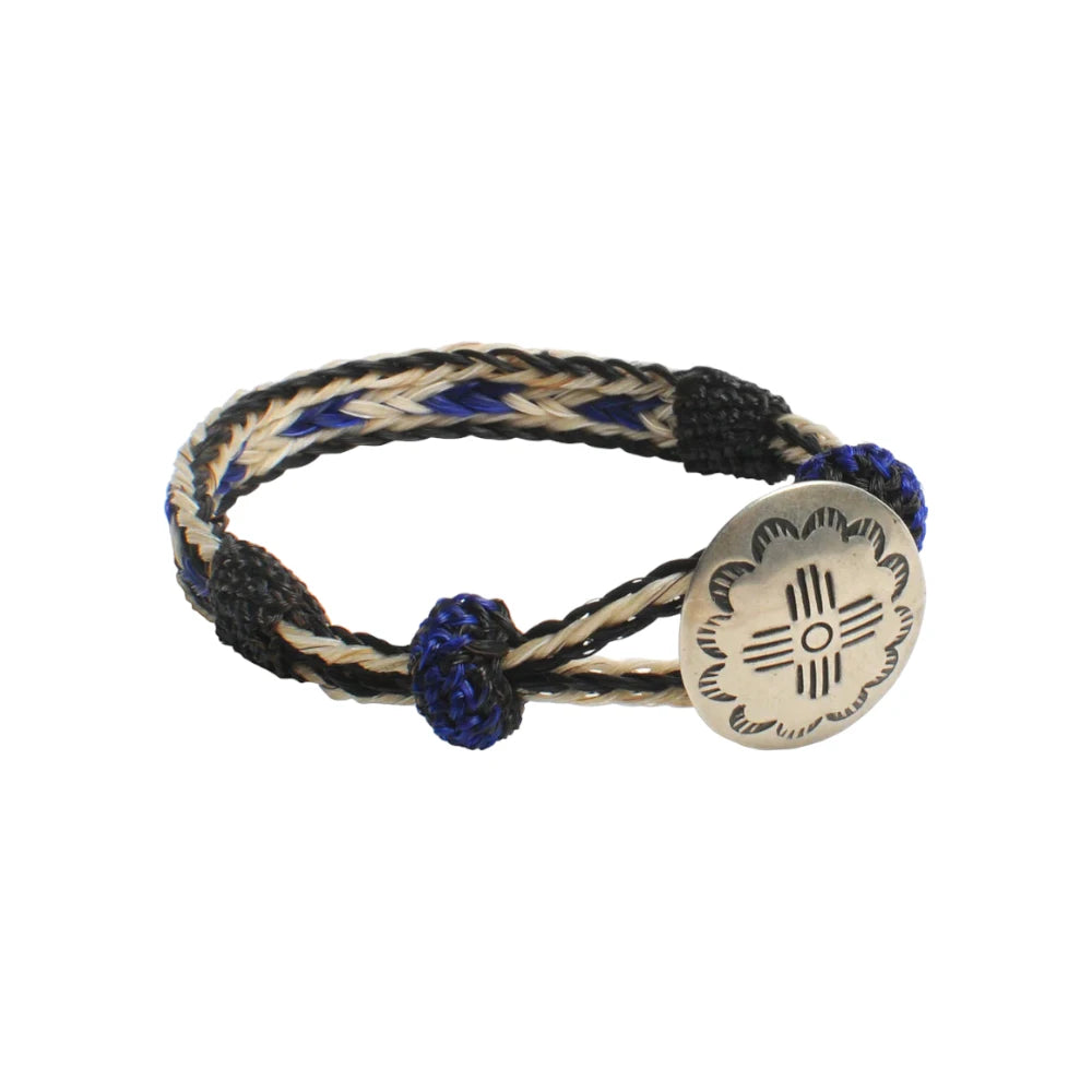 Front view of the Chamula Concho Bracelet #05-105 Blk x Wht/Blu showing the woven leather strap in black, white, and blue tones with a concho centerpiece for Clothier & Sons.