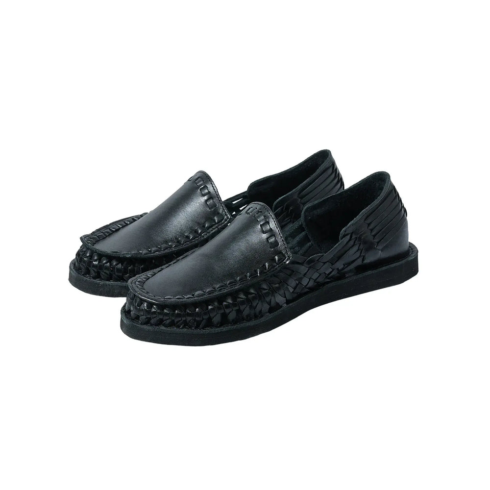 Front three-quarter view of the Chamula Durango Black showing the ankle boot silhouette, smooth black leather upper, and handcrafted construction for Clothier & Sons.