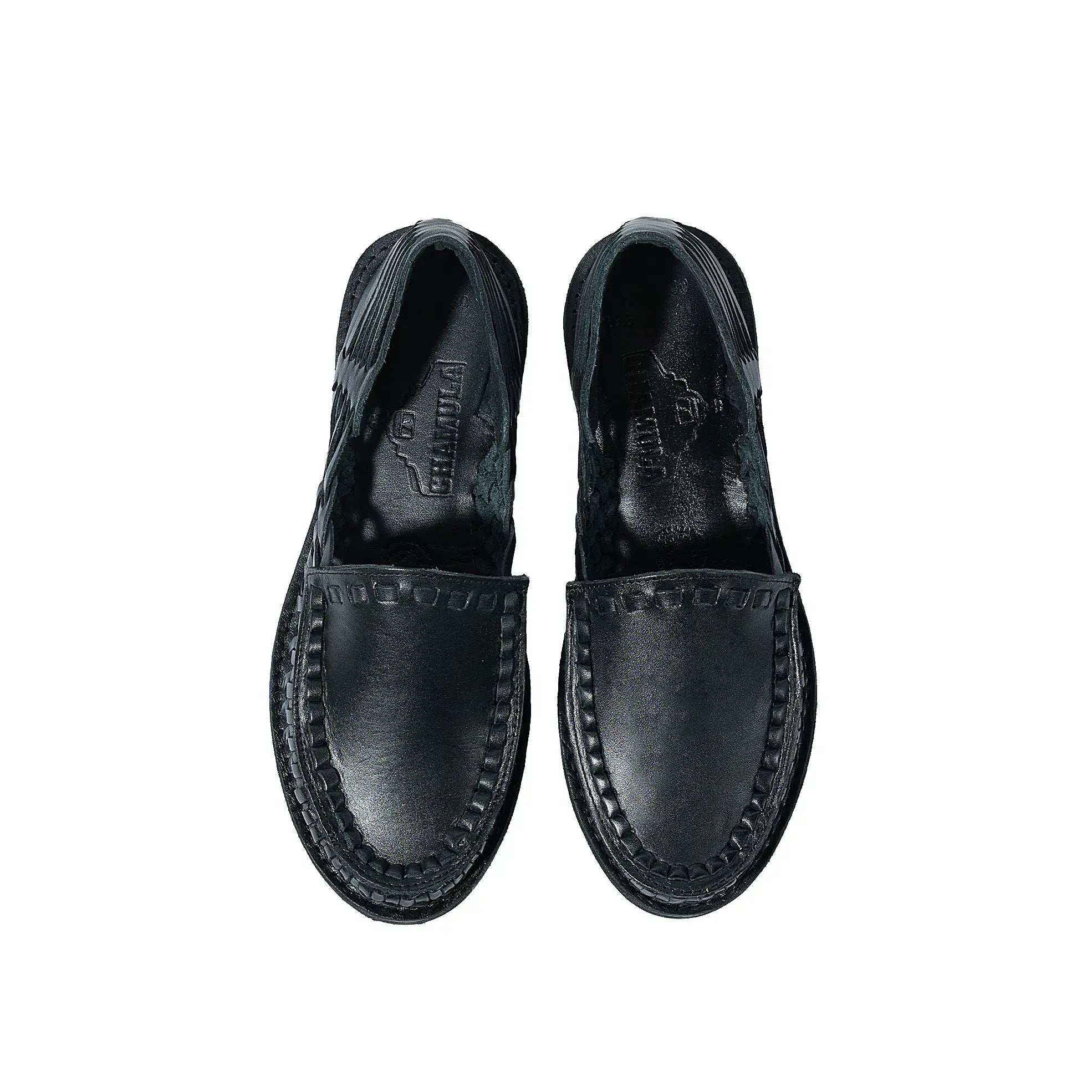 Side profile of the Chamula Durango Black showing ankle height proportion, stacked heel, and refined handcrafted silhouette for Clothier & Sons.