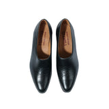 Close-up leather detail of the Chamula Saarinen Black Leather highlighting natural grain texture and polished finish for Clothier & Sons.