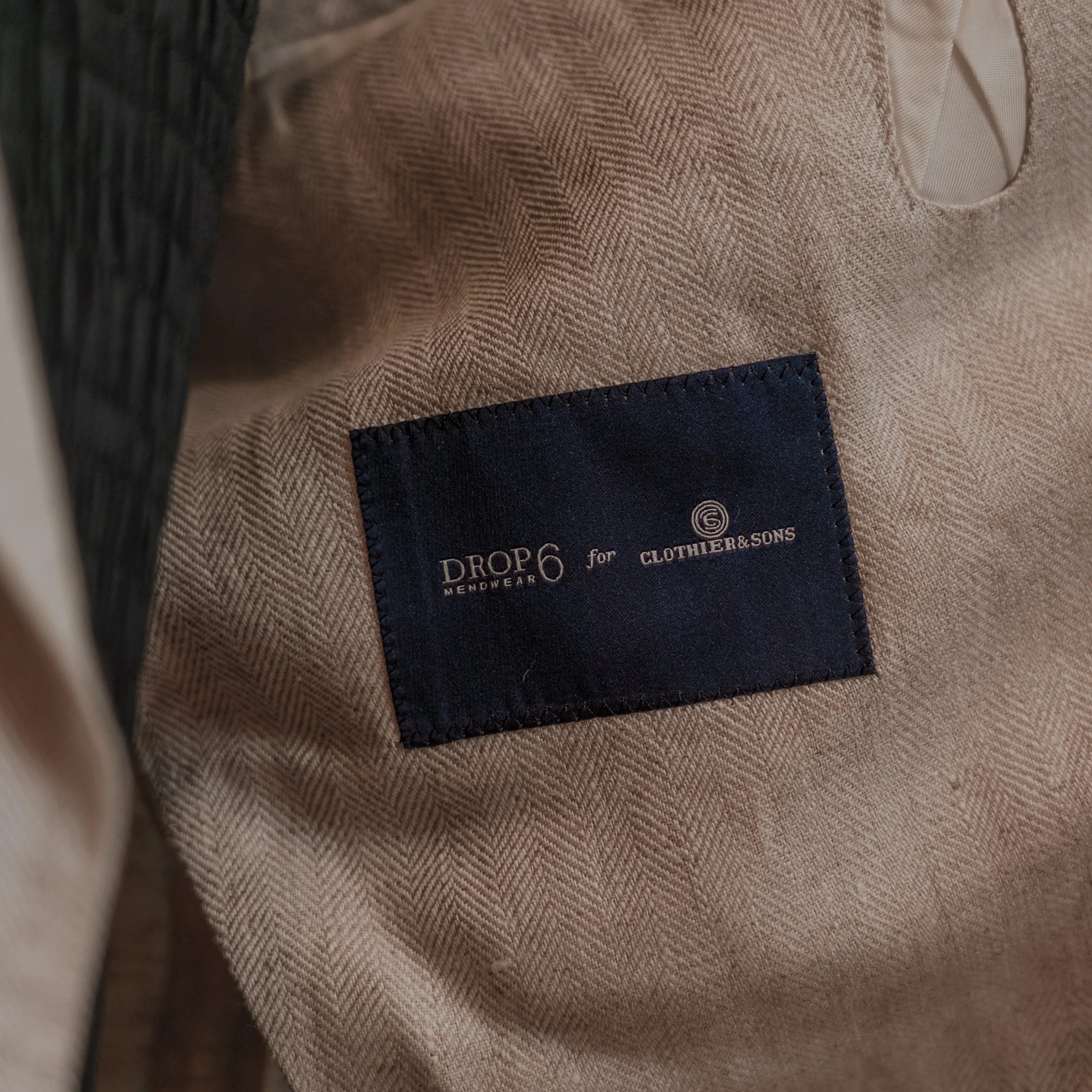 Drop6 Herringbone Linen Double Breasted Suit Ivory Interior Brand Label Detail