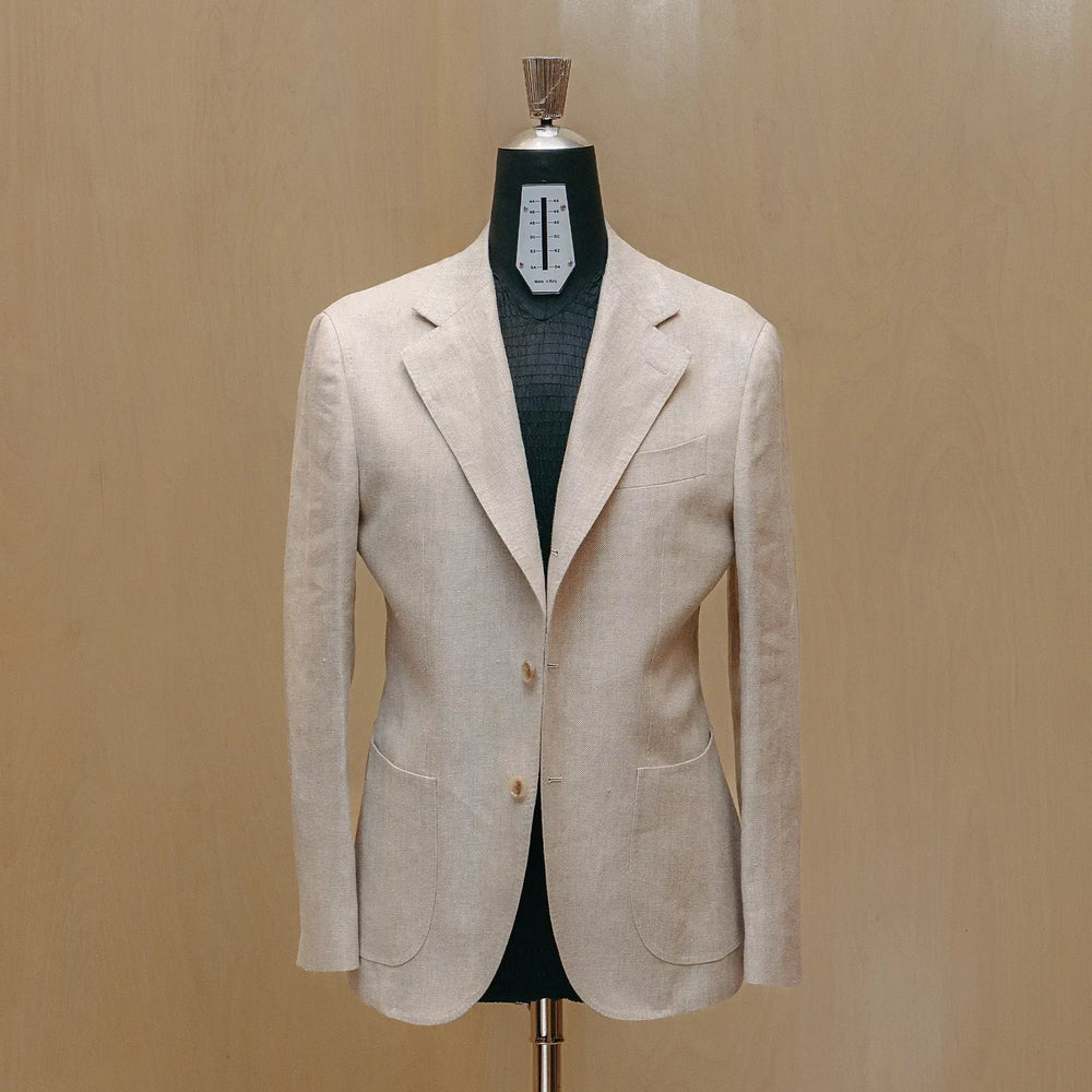 Full body view of the Drop6 Linen Suit Oatmeal highlighting overall proportions, lightweight construction, and clean summer tailoring for Clothier & Sons.