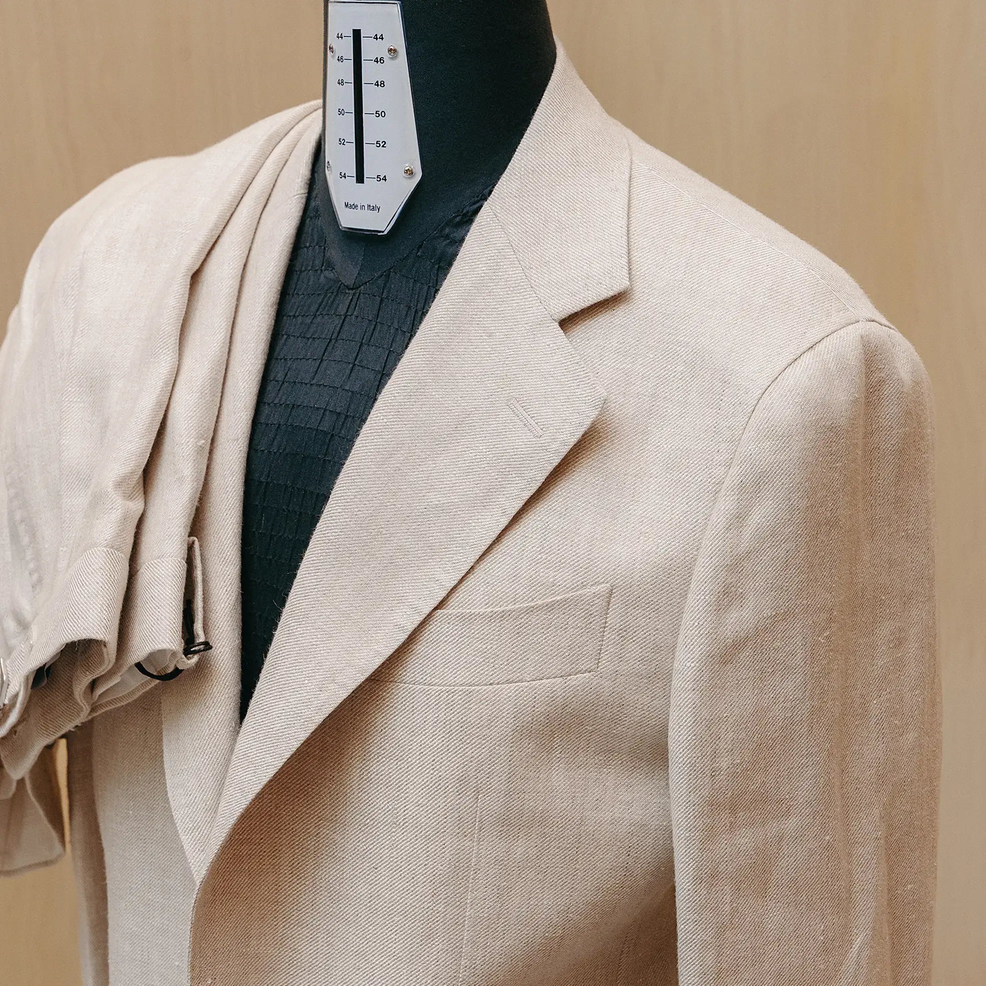 Lapel detail of the Drop6 Linen Suit Oatmeal highlighting lapel shape, stitching, and refined casual finishing for Clothier & Sons.