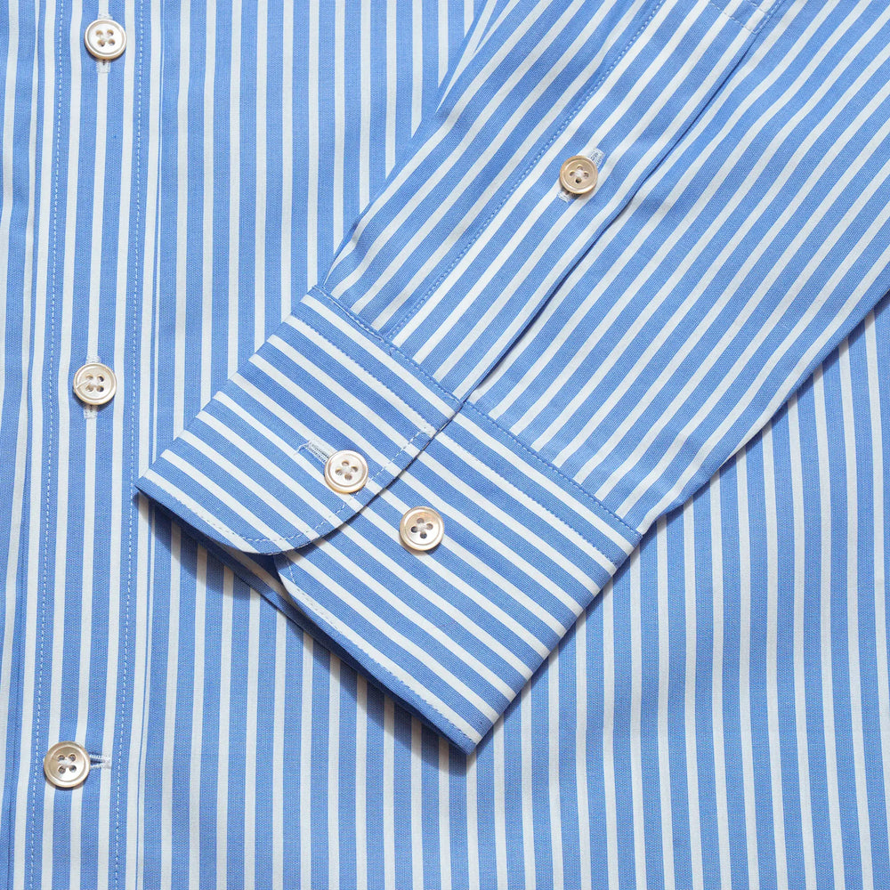 Cuff detail of the Drop6 New Bengal Stripe Button Down Shirt Blue showing sleeve placket construction and button fastening for Clothier & Sons.
