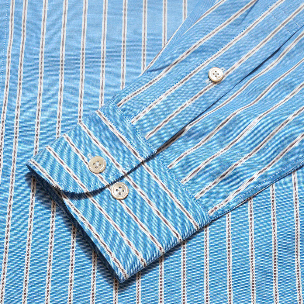 Cuff detail of the Drop6 New Bold Stripe Button Down Shirt Blue showing sleeve placket construction and button fastening for Clothier & Sons.