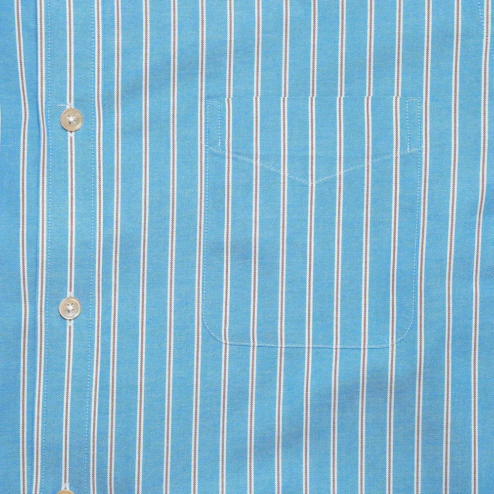 Chest pocket detail of the Drop6 New Bold Stripe Button Down Shirt Blue highlighting stripe matching and clean seam finishing for Clothier & Sons.
