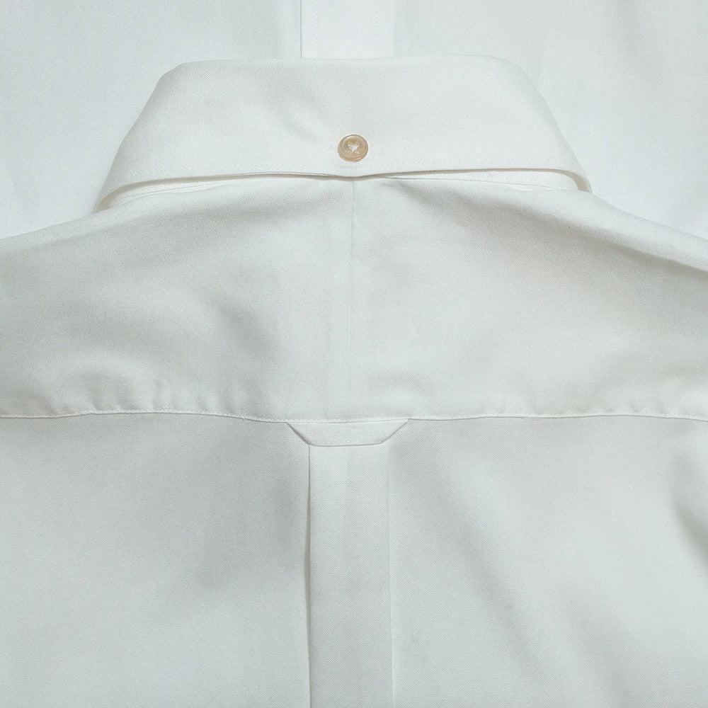 Back detail of the Drop6 New Plain Oxford Button Down Shirt White showing yoke construction and center back seam finishing for Clothier & Sons.
