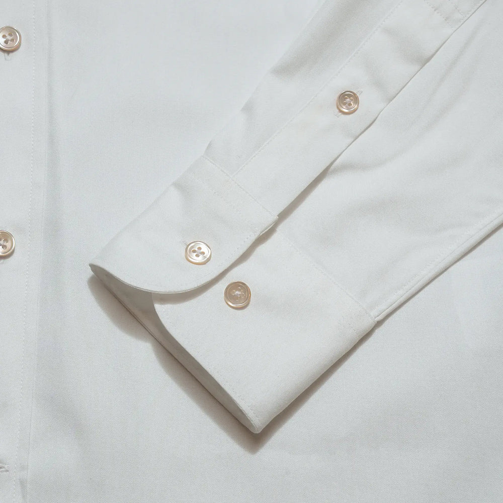 Cuff detail of the Drop6 New Plain Oxford Button Down Shirt White showing sleeve placket construction and button fastening for Clothier & Sons.
