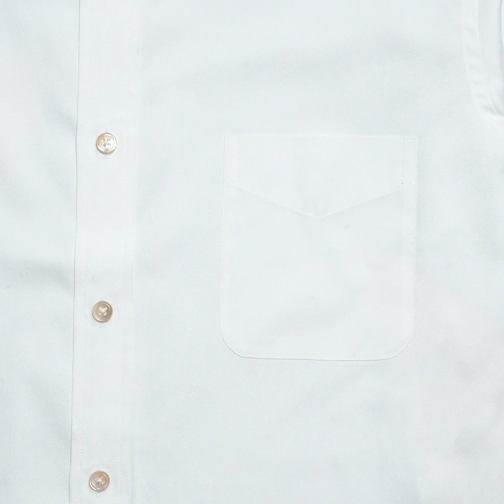 Chest pocket detail of the Drop6 New Plain Oxford Button Down Shirt White highlighting clean stitching and minimal design for Clothier & Sons.