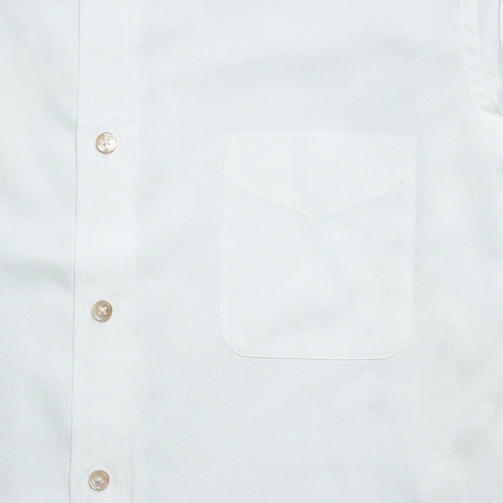 Chest pocket detail of the Drop6 New Plain Oxford Button Down Shirt White highlighting clean stitching and minimal design for Clothier & Sons.