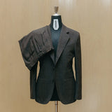 Front view of the Drop6 Wool Suit Charcoal Grey showing the single breasted silhouette, charcoal grey tone, and clean tailored structure for Clothier & Sons.