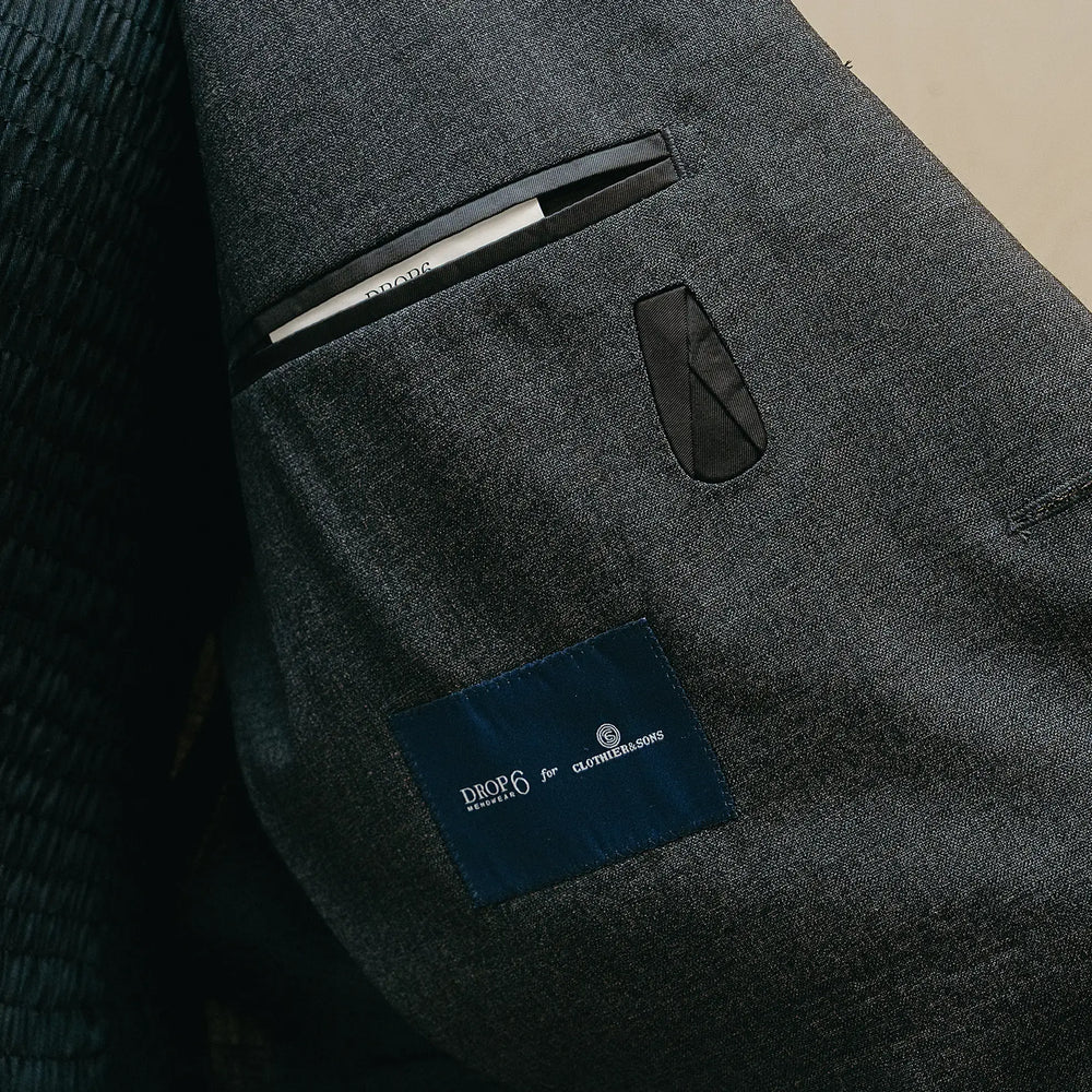 Inside pocket detail of the Drop6 Wool Suit Charcoal Grey showing interior construction, pocket finishing, and clean tailoring work for Clothier & Sons.