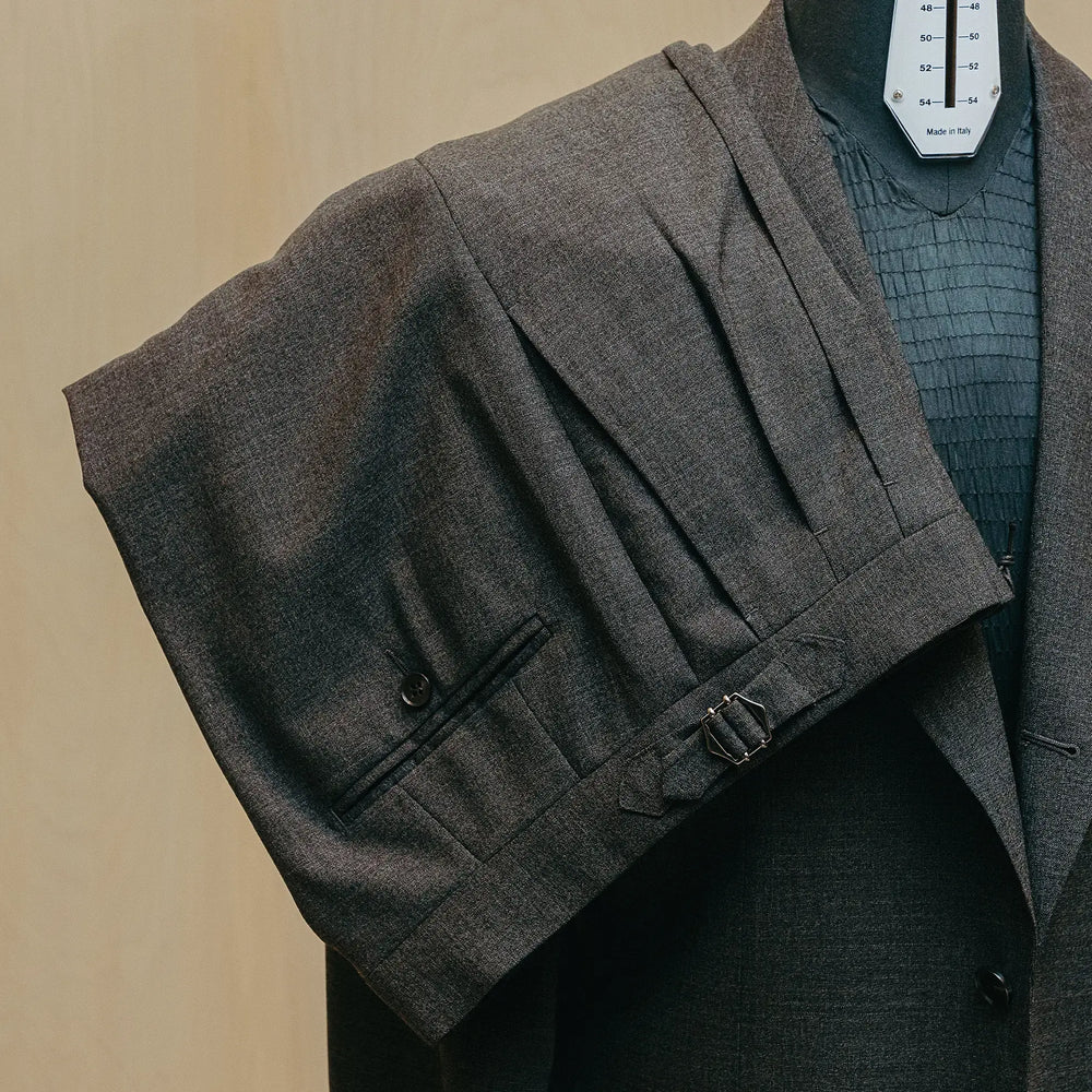 Trousers detail of the Drop6 Wool Suit Charcoal Grey showing crease line, fabric drape, and matching wool texture for Clothier & Sons.