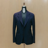 Front view of the Drop6 Wool Suit Navy showing the single breasted silhouette, deep navy tone, and clean tailored structure for Clothier & Sons.
