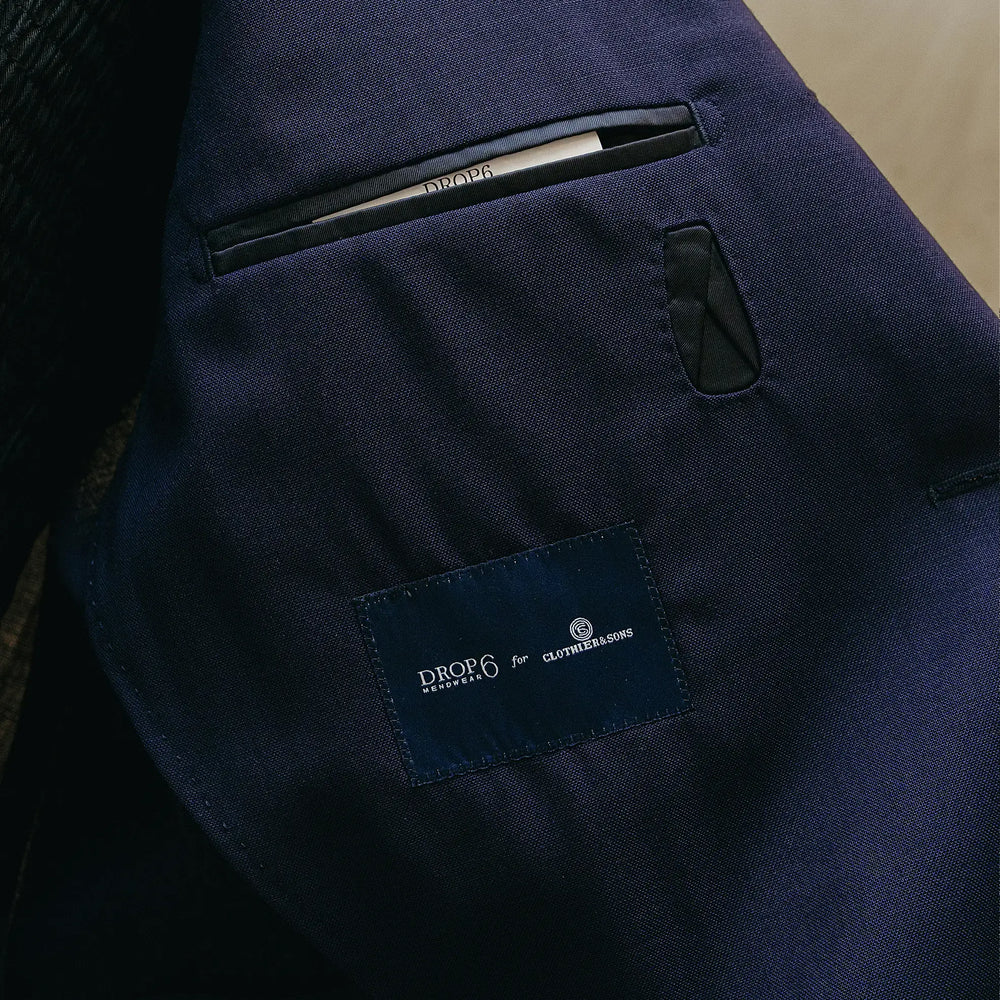 Inside pocket detail of the Drop6 Wool Suit Navy showing interior construction, pocket finishing, and clean tailoring workmanship for Clothier & Sons.