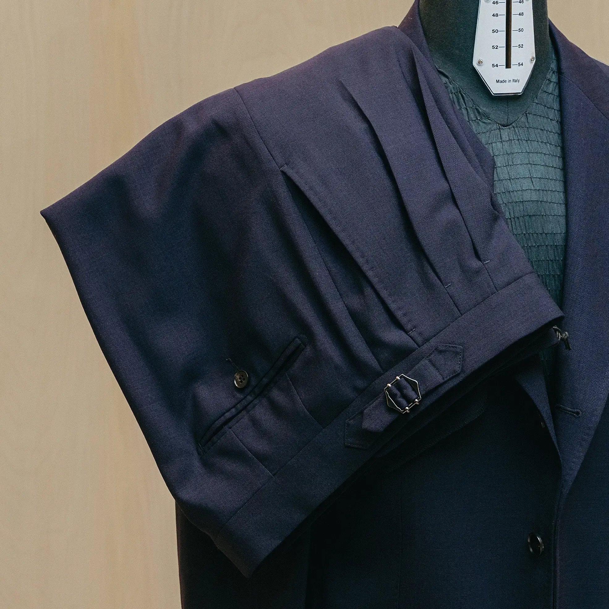 Trousers detail of the Drop6 Wool Suit Navy showing sharp crease line, fabric drape, and matching wool texture for Clothier & Sons.