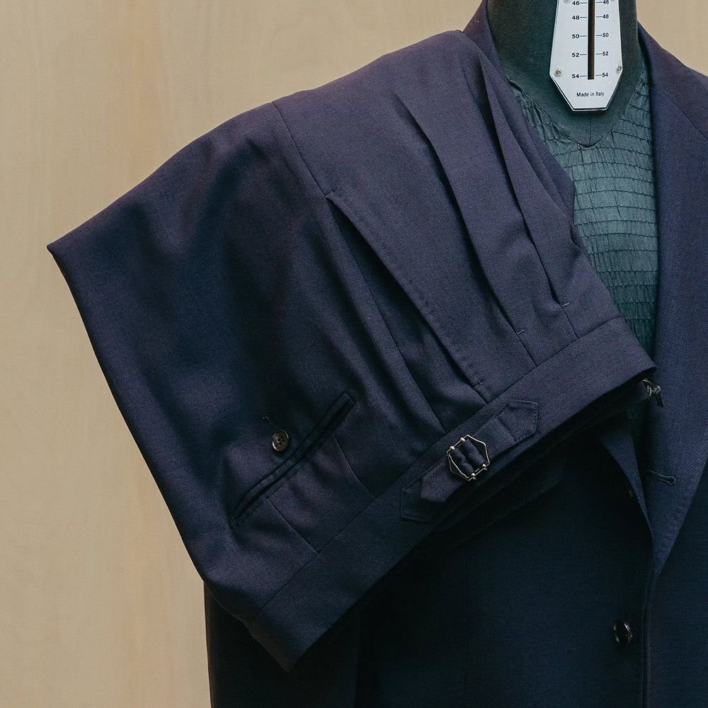 Trousers detail of the Drop6 Wool Suit Navy showing sharp crease line, fabric drape, and matching wool texture for Clothier & Sons.