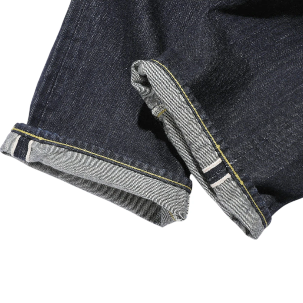 Fabric detail of the Jelado S301xx 1942wpb L-181 Simplified Model revealing vintage-style selvedge denim texture, uneven yarn character, and rich indigo tone for Clothier & Sons.