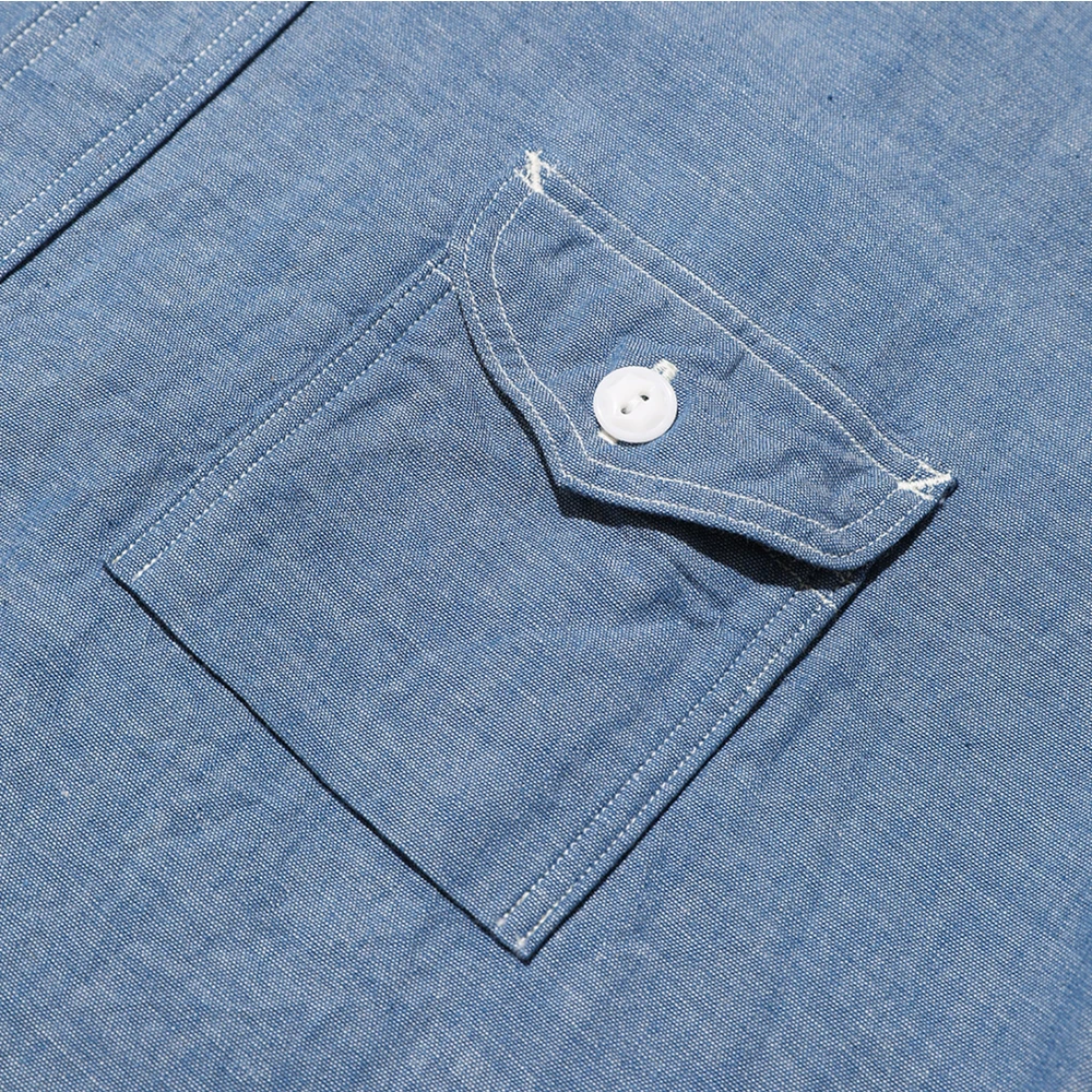 Pocket detail of the Jelado Smoker Shirt Indigo Chambray Indigo highlighting chest pocket design, seam finishing, and functional workwear construction for Clothier & Sons.

