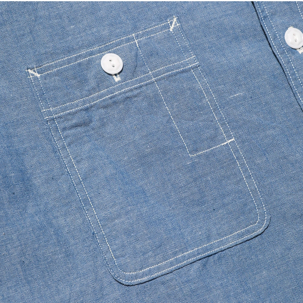 Pocket detail of the Jelado Smoker Shirt Indigo Chambray Indigo highlighting chest pocket design, seam finishing, and functional workwear construction for Clothier & Sons.