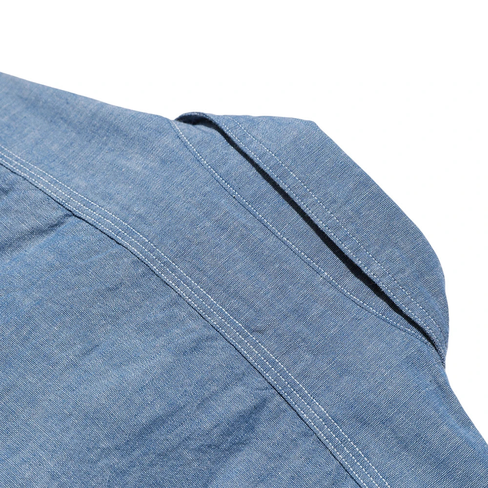 Side profile of the Jelado Smoker Shirt Indigo Chambray Indigo showing shirt length, sleeve shape, and relaxed vintage fit for Clothier & Sons.