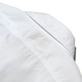 Side profile of the Jelado Smoker Shirt White showing shirt length, sleeve shape, and relaxed vintage fit for Clothier & Sons.