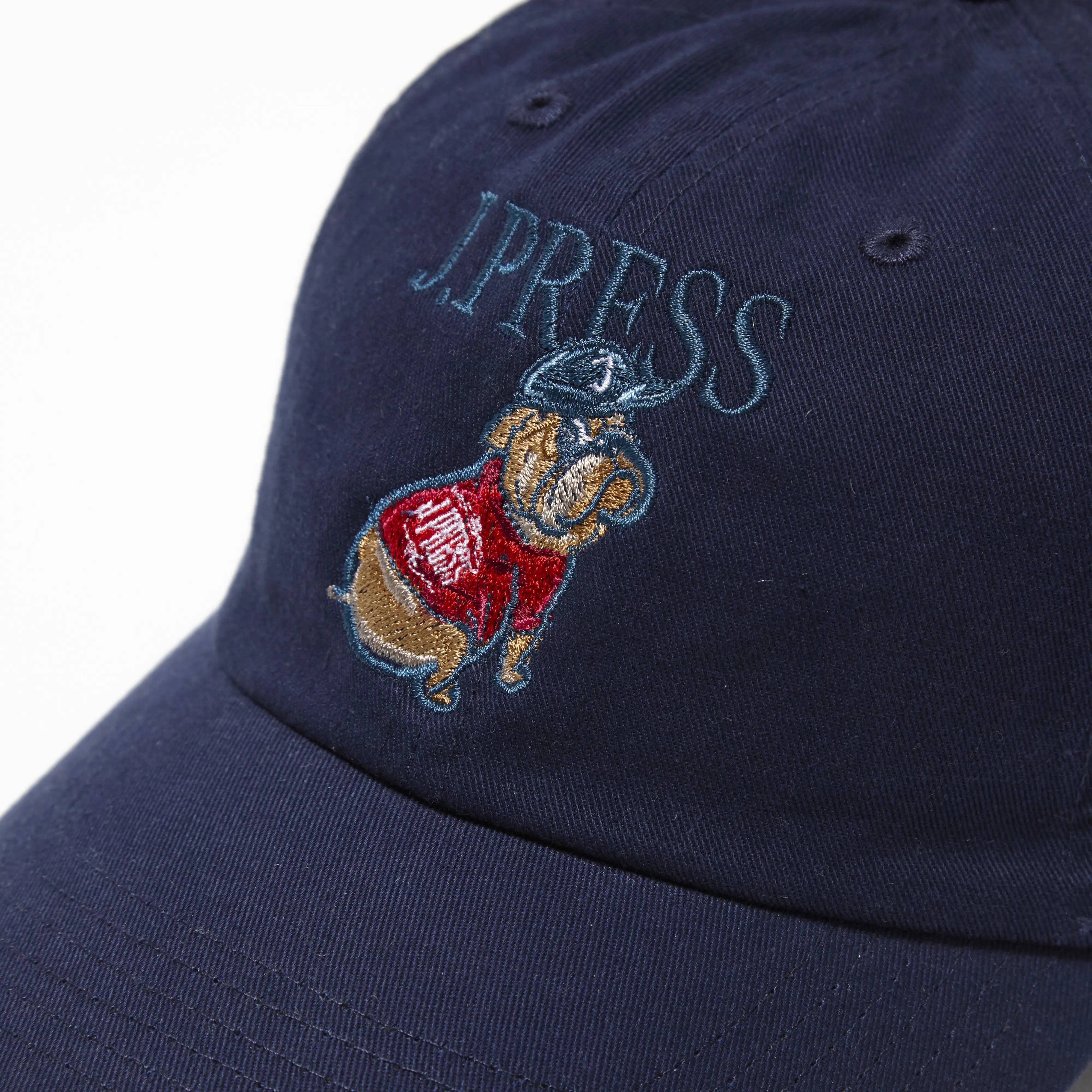 Top view of the J.Press Aaron Chang Cotton Twill Baseball Cap Navy showing panel construction, ventilation eyelets, and crown shape for Clothier & Sons.