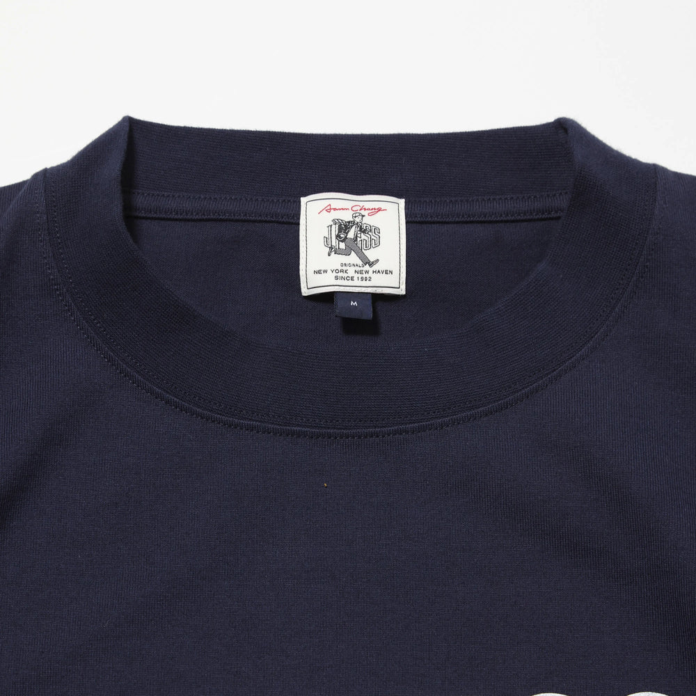 Collar detail of the J.Press Aaron Illust T-shirt Graphic Navy showing ribbed neckline construction and clean finishing for Clothier & Sons.
