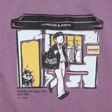 Graphic detail of the J.Press Aaron Illust T-shirt Graphic Purple showing printed illustration and design placement for Clothier & Sons.

