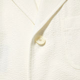 Fabric detail of the J.Press Silk Seersucker 3B Sack Jacket White revealing textured seersucker weave and breathable summer fabric for Clothier & Sons.
