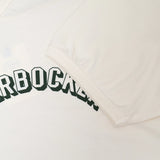 Fabric detail of the Knickerbocker Track Tee Milk revealing cotton jersey texture, soft hand feel, and smooth milk color tone for Clothier & Sons.