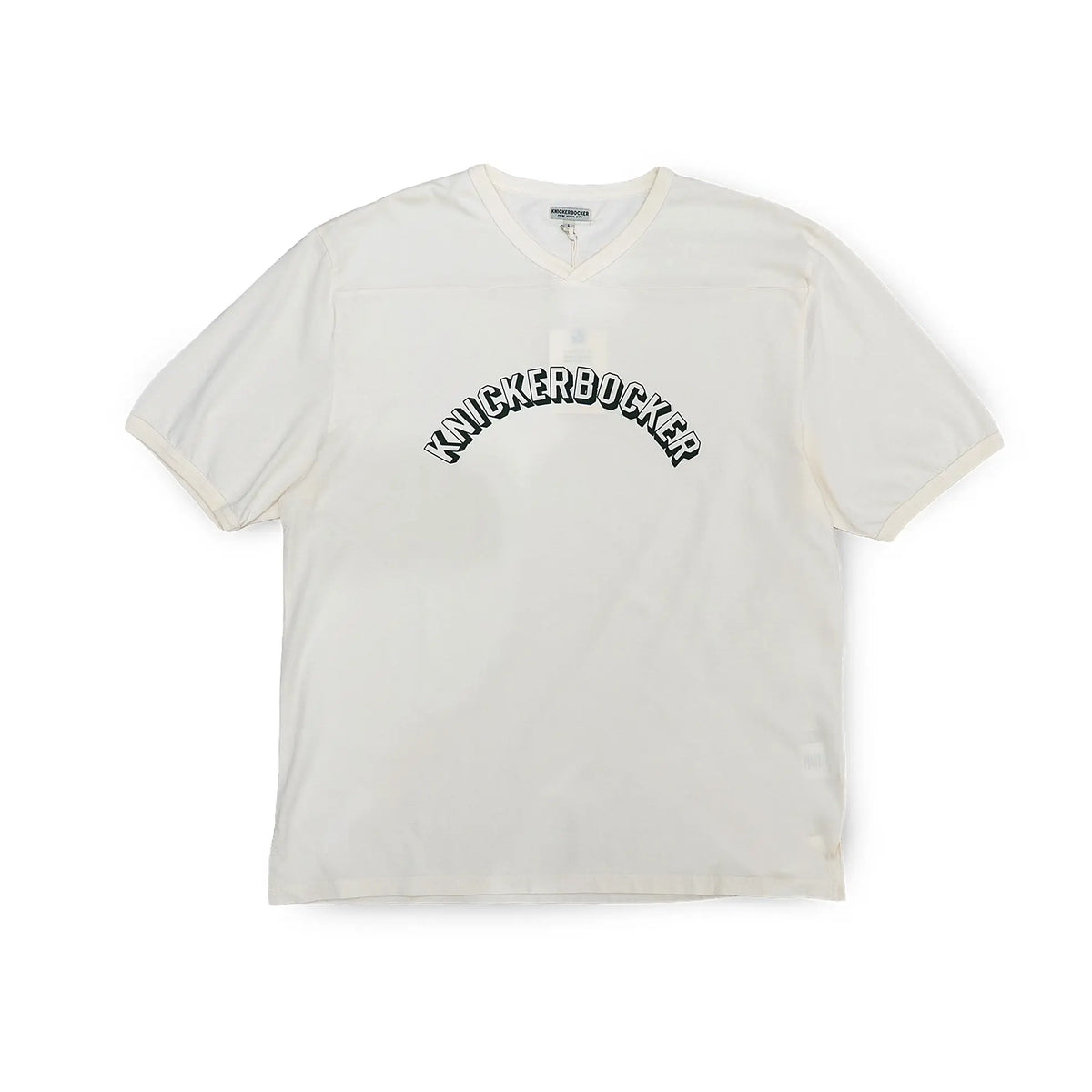 Front view of the Knickerbocker Track Tee Milk showing the classic track tee silhouette, soft milk tone, and clean minimalist design for Clothier & Sons.