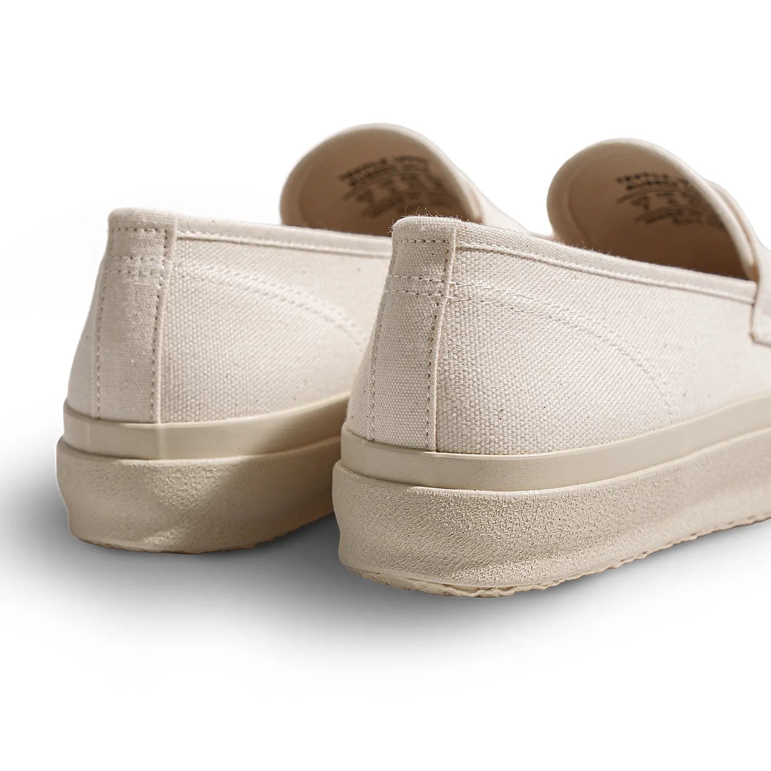 Back view of the Moonstar Loafy Natural highlighting heel construction, stitching, and rubber sole finish for Clothier & Sons.