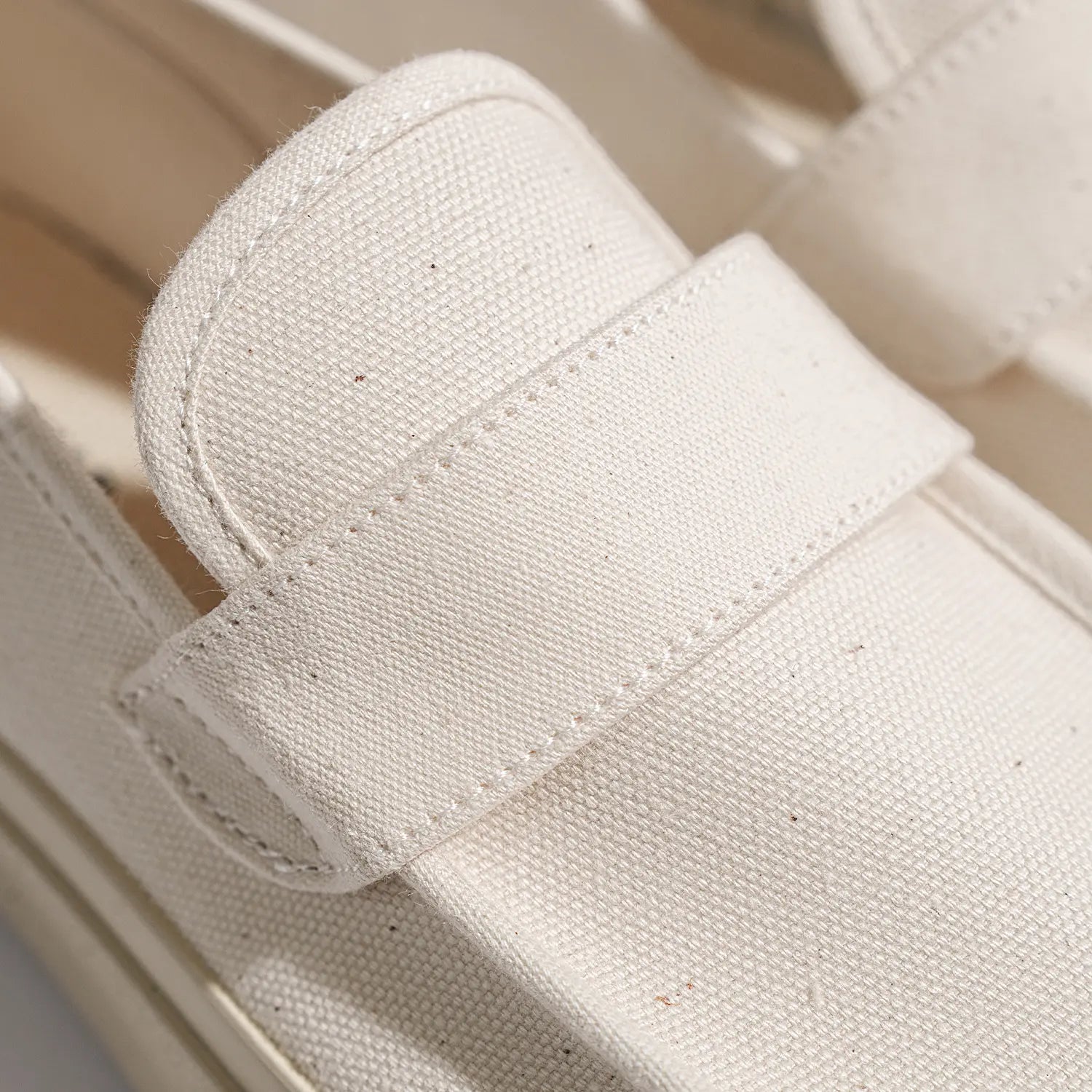 Close-up detail of the Moonstar Loafy Natural showing canvas strap design, stitching, and texture for Clothier & Sons.